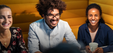 Three friends laughing together