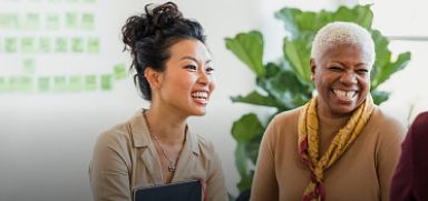 Two people laughing together